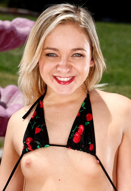 Playful little Cleo gets naked and shares her shaved pussy - 5 of 16