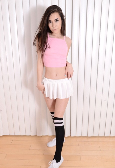 Sexy brunette teen Ariel poses naked in tall socks - 2 of 16