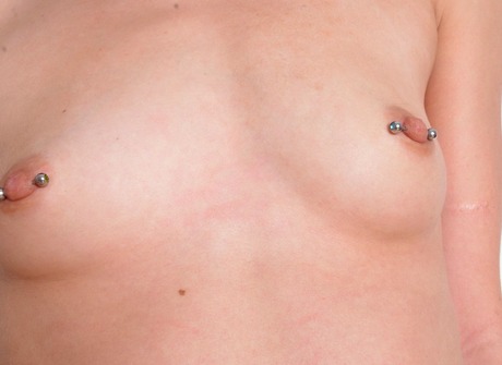 Skinny teen Avery strips naked and shows her pierced nipples - 10 of 16