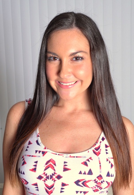 Sultry brunette Brittany strips to show her pussy up close