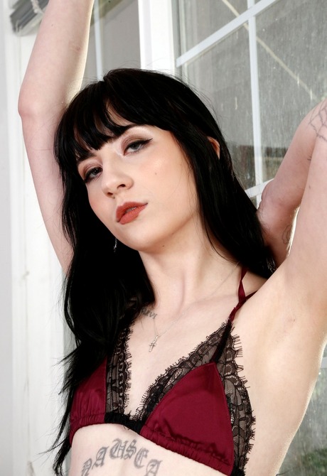 Naughty Charlotte strips naked to show her shaved pussy - 3 of 16