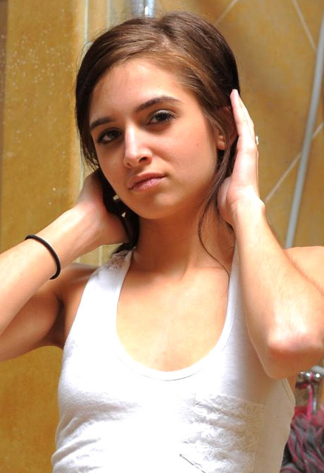 Skinny brunette coed Jade gets herself all wet in the shower