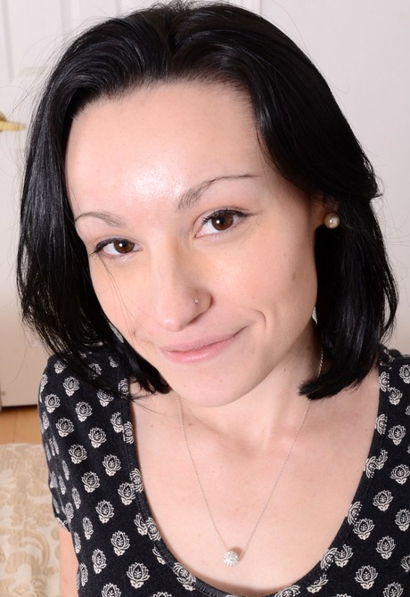 Dark haired June shows off her tasty pussy and pierced tits - 2 of 16