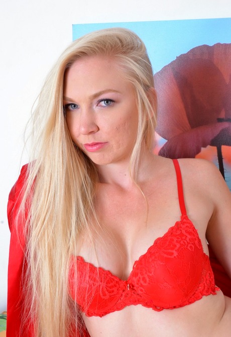 Sensual blonde Kara takes off her lingerie and pets her twat