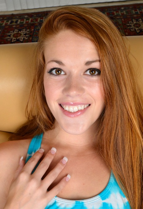 Flirty redhead Kimberly bends over to spread her pussy open - 3 of 16