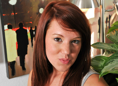 Horny brunette coed Lizzie fingers her pussy on the couch - 2 of 15