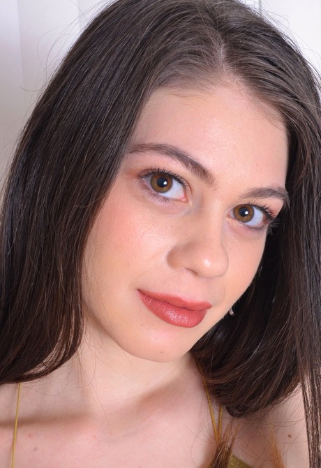 Stunning brunette teen Marina fingers her tight little pussy - 2 of 16