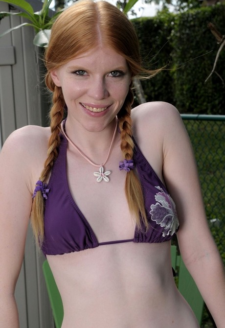 Pale redhead teen strips off bikini and spreads outdoors - 3 of 16