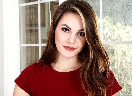 Glamorous Rayna stripteases and pets her smooth little pussy - 2 of 16