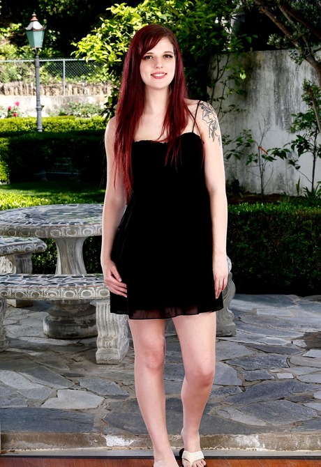 Mischievous redhead teen Scarlett strips and teases outdoors
