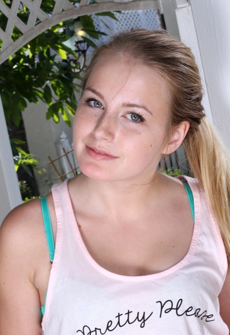 Pretty teen Scarlett stripteases and poses playfully outside - 2 of 16