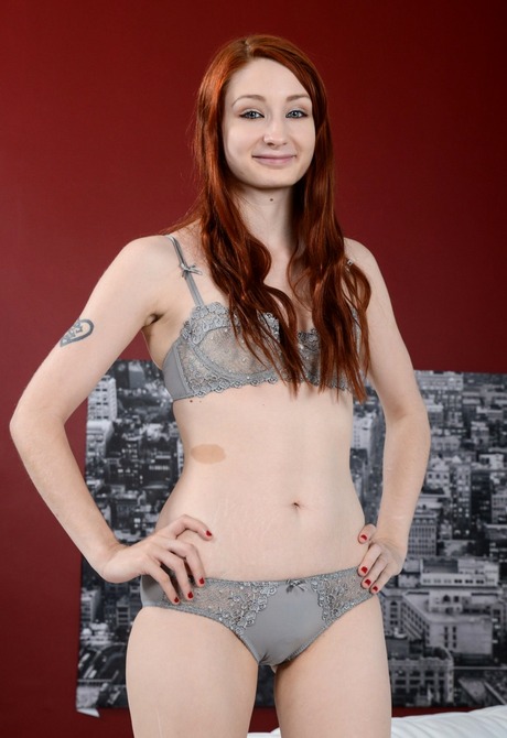 Pale redhead Violet gets naked and shows her unshaved pussy - 2 of 16