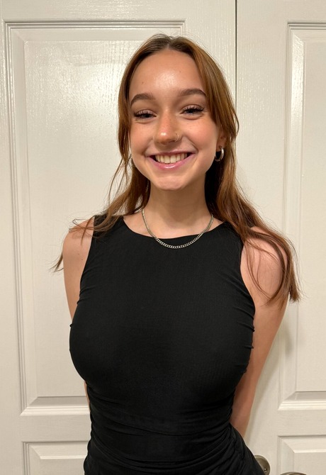 Tattooed teen gives a closeup of her pussy during her striptease session - 2 of 16