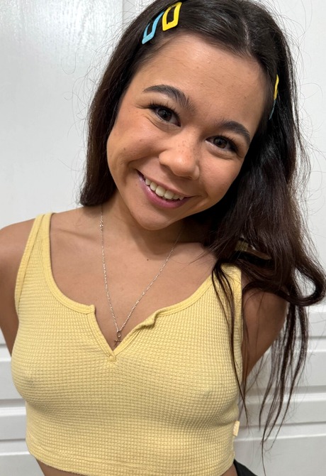 Asian cutie Brianna Arson teases in different positions while in stockings - 2 of 16