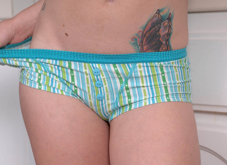 Curly haired redhead Katie getting tits and pussy wet - 5 of 16