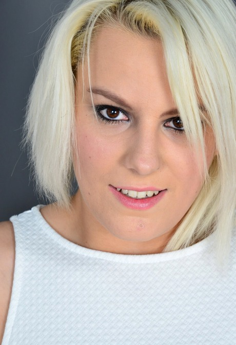 Blonde secretary Lucy Shine lifts up dress to reveal shaved pussy before big tits - 9 of 16