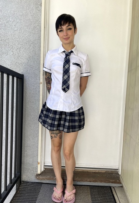 Stevie Moon strips her School Uniform flaunting small tits and shaved pussy - 1 of 16