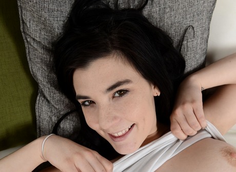 Perky teen Jenna Reid teasing and showing pussy on couch - 4 of 16