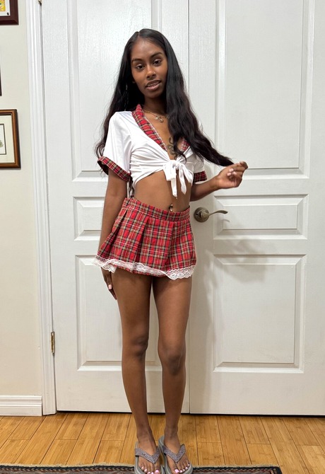 Exotic teen Fae Love teasing in schoolgirl outfit and spreading pink pussy - 1 of 16