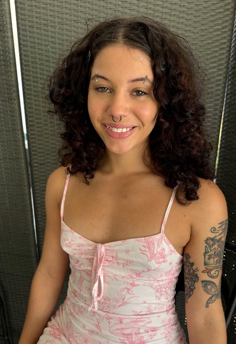 Tattooed brunette Nicole Luva teases with feet before spreading pussy and going topless - 2 of 16