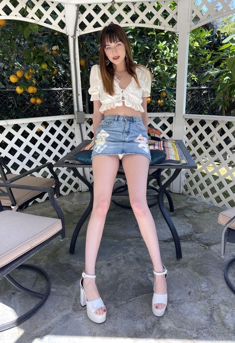 Cute amateur teen Lana Smalls shows upskirt pussy shots in jean skirt