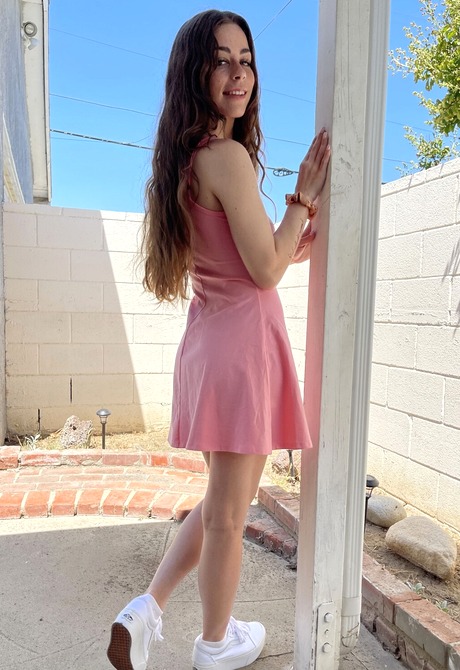 Renee Rose seductively gets naked on the couch presenting her pink pussy