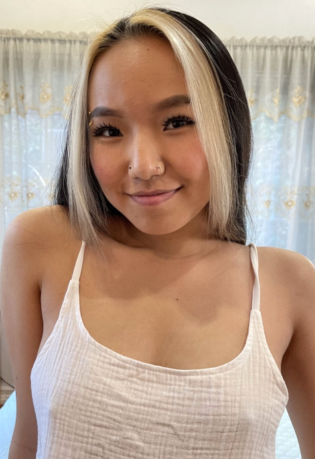 Petite teen Asia Lee getting naked and spreading shaved pussy