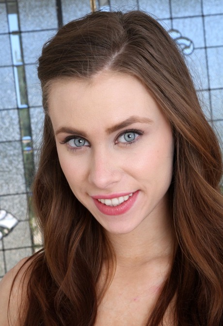 Brunette with blue eyes Anya Olsen teases while wearing black stockings and high heels - 2 of 16