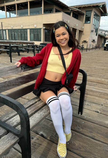 Cute Asian Brianna Arson wears knee socks outdoors in public and flashes pussy at beach - 9 of 16