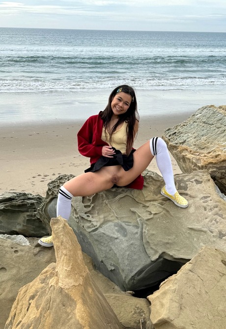 Cute Asian Brianna Arson wears knee socks outdoors in public and flashes pussy at beach - 11 of 16