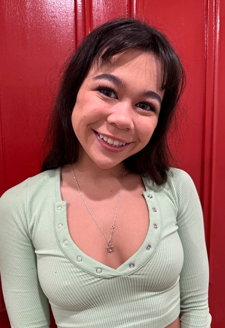 Brianna Arson in heels and knee socks highlights feet on the couch after stripping - 2 of 16