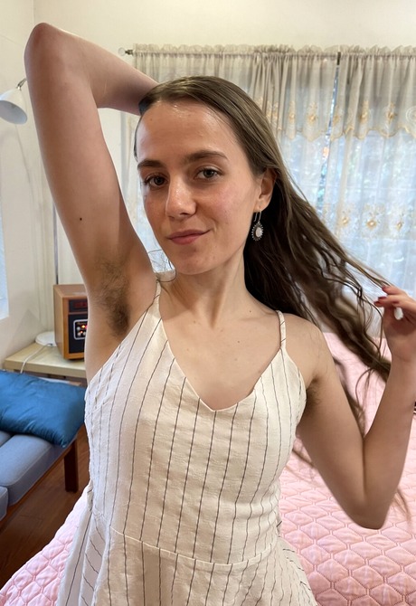 Sia Wood having fun flaunting her pussy while getting naked in the bedroom - 2 of 16