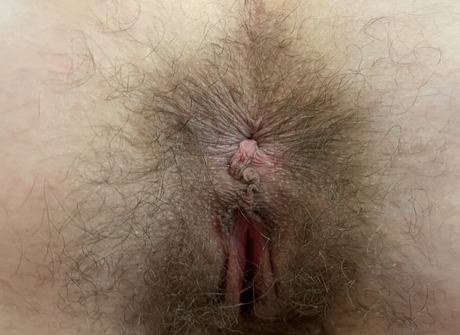 Sia Wood having fun flaunting her pussy while getting naked in the bedroom - 8 of 16