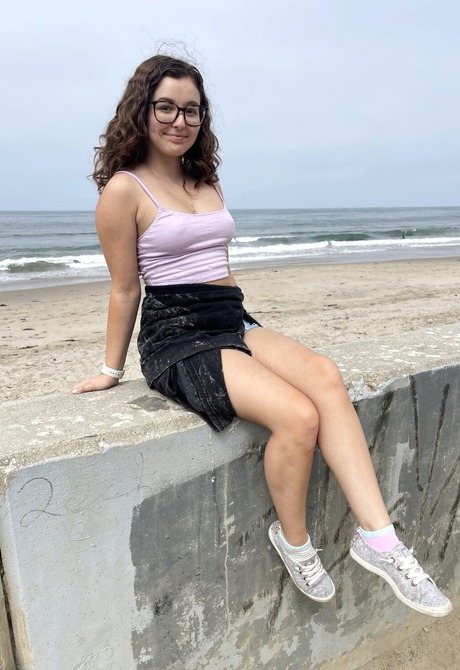 Amateur cutie Leana Lovings flashing tits by the beach in jean shorts - 4 of 16
