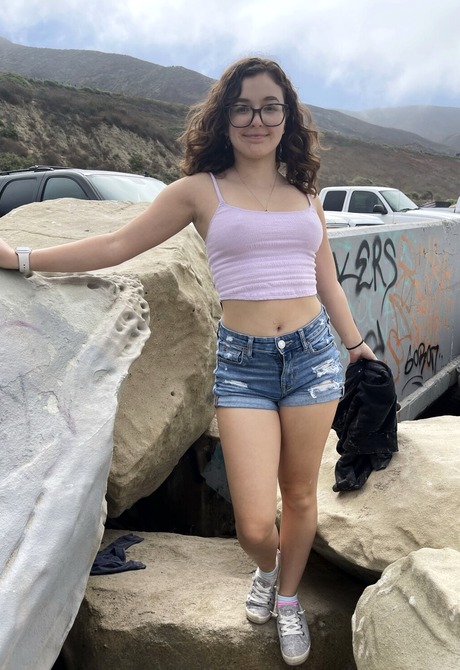 Amateur cutie Leana Lovings flashing tits by the beach in jean shorts