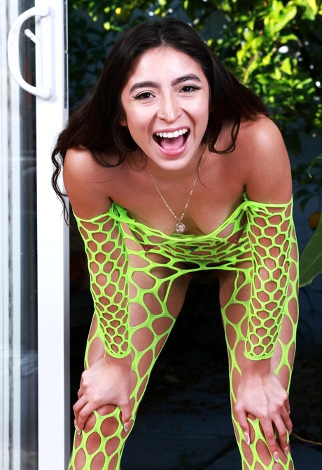 Exotic small tits amateur Amber Summer posing in fishnet bodysuit - 4 of 16