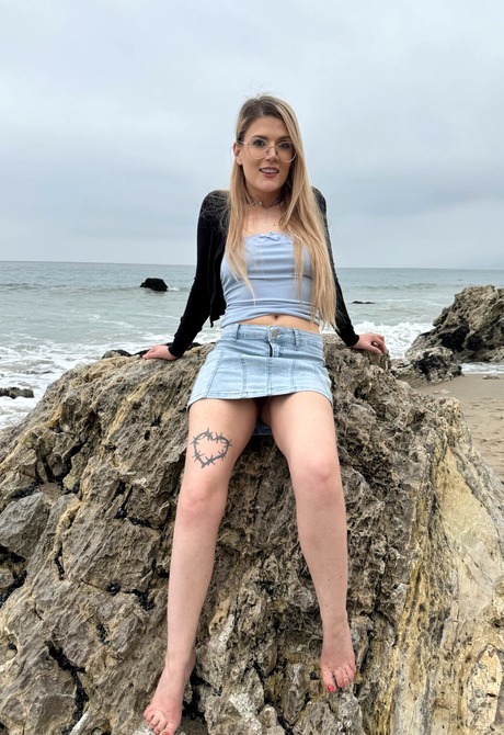 Blonde with glasses Riley Rose shows hairy pussy outdoors before indoor teasing - 15 of 16